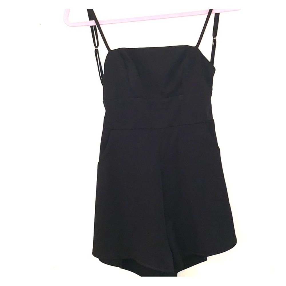 Seek the label Romper. NWOT